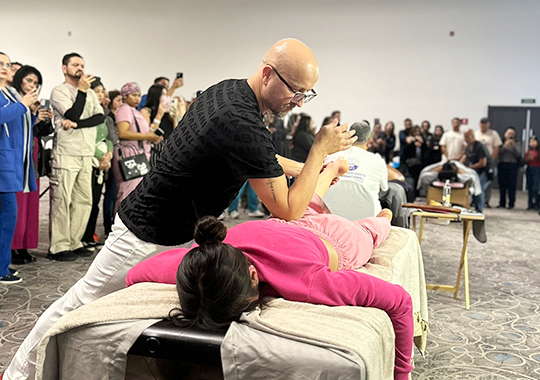 a-live-demonstration-of-a-therapy-session-in-a-large-conference-or-workshop-setting