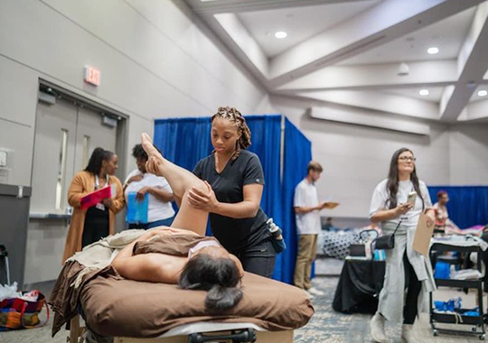 a-massage-therapist-is-performing-a-therapeutic-stretch